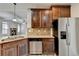 The kitchen features an island sink, granite counters, stainless appliances, and lots of cabinets at 4463 Grove Lake St, Loganville, GA 30052
