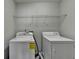 Laundry room with washer and dryer at 4463 Grove Lake St, Loganville, GA 30052