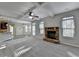 Open concept living room featuring fireplace at 4463 Grove Lake St, Loganville, GA 30052