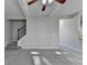 Neutral living room with stairs at 4463 Grove Lake St, Loganville, GA 30052