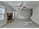 Spacious living room with fireplace and large windows at 4463 Grove Lake St, Loganville, GA 30052