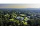 An aerial view of the green golf course, pond, and clubhouse amenities at 80 La Rue Nw Pl, Atlanta, GA 30327