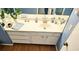 Bathroom vanity with white countertop, cabinets, decor items, and light blue wall paint at 80 La Rue Nw Pl, Atlanta, GA 30327