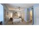 Serene bedroom with blue walls, ceiling fan, closet, and a comfortable four-poster bed at 80 La Rue Nw Pl, Atlanta, GA 30327