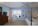 Bright bedroom with large windows, wood furniture, ceiling fan, and hardwood floors at 80 La Rue Nw Pl, Atlanta, GA 30327