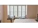 Bedroom nook with plantation shutters, floral cushion seating, and a decorative pillow at 80 La Rue Nw Pl, Atlanta, GA 30327