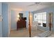 Bedroom featuring hardwood floors, a ceiling fan, and ample natural light, perfect for relaxing at 80 La Rue Nw Pl, Atlanta, GA 30327