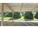 Interior view of carport with visible parking spaces and lush green bushes in the background at 80 La Rue Nw Pl, Atlanta, GA 30327