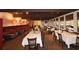 Well-lit dining room with tables set for service and a view of the outdoor area at 80 La Rue Nw Pl, Atlanta, GA 30327