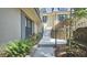 Exterior elevation of side entrance showcasing charming landscaping and stone stairs at 80 La Rue Nw Pl, Atlanta, GA 30327