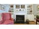 Cozy fireplace with marble surround and built-in shelving, creating a warm and inviting focal point at 80 La Rue Nw Pl, Atlanta, GA 30327