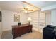 Office with a large desk, ceiling fan and built-in shelving at 80 La Rue Nw Pl, Atlanta, GA 30327