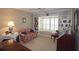 Cozy living room with custom bookshelves, a window seat and lots of natural light at 80 La Rue Nw Pl, Atlanta, GA 30327