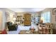 Traditional living room with built-in bookshelves, cozy seating arrangement and natural light at 80 La Rue Nw Pl, Atlanta, GA 30327
