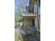 Charming patio with lush plantings, outdoor seating and staircase at 80 La Rue Nw Pl, Atlanta, GA 30327