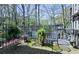 Charming patio area with brick flooring, outdoor furniture, and lush greenery creating a serene outdoor space at 80 La Rue Nw Pl, Atlanta, GA 30327