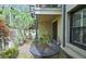 Brick patio with outdoor seating, beautiful garden views, and spiral staircase at 80 La Rue Nw Pl, Atlanta, GA 30327