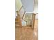 Staircase with beautiful oak steps, white risers, and patterned parquet wood flooring at 80 La Rue Nw Pl, Atlanta, GA 30327