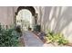 Charming walkway leading to the entrance, enhanced by lush greenery and an arched entryway at 80 La Rue Nw Pl, Atlanta, GA 30327