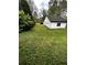 Spacious backyard with green lawn at 1864 Drew Cir, Austell, GA 30168