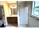Clean bathroom with a double vanity, a shower, and a window at 1864 Drew Cir, Austell, GA 30168