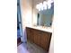 Bathroom featuring a wood double vanity with marble countertop and modern fixtures at 1864 Drew Cir, Austell, GA 30168