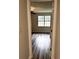 Bedroom with ceiling fan and window, featuring dark wood-look floors at 1864 Drew Cir, Austell, GA 30168