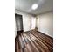 Bedroom featuring hardwood floors and a closet at 1864 Drew Cir, Austell, GA 30168