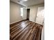 Bedroom with hardwood floors, a window, and closet space at 1864 Drew Cir, Austell, GA 30168