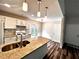 The kitchen features an island sink with granite countertops, white cabinetry, and new appliances at 1864 Drew Cir, Austell, GA 30168