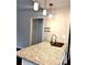 Close up of the kitchen island features granite countertops, pendant lighting, and a modern faucet at 1864 Drew Cir, Austell, GA 30168