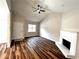 Inviting living room features hardwood floors, fireplace, and large window for natural light at 1864 Drew Cir, Austell, GA 30168
