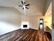 Inviting living room features beautiful wood floors, a cozy fireplace, and an open floor plan at 1864 Drew Cir, Austell, GA 30168