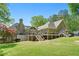 Large backyard with sprawling lawn and multi-level deck, ideal for outdoor living and entertaining with scenic views at 4340 Hadaway Nw Rd, Kennesaw, GA 30152