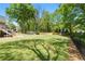 Sprawling backyard featuring a storage shed, play area, and ample space for outdoor activities at 4340 Hadaway Nw Rd, Kennesaw, GA 30152