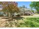 Lush backyard with a spacious deck, mature trees, and well-manicured lawn at 4340 Hadaway Nw Rd, Kennesaw, GA 30152