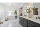 Bright bathroom featuring double vanity sinks, standalone tub, and skylight at 4340 Hadaway Nw Rd, Kennesaw, GA 30152