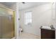 Neat bathroom featuring a glass-enclosed shower, modern vanity, and neutral tile flooring, offering a functional space at 4340 Hadaway Nw Rd, Kennesaw, GA 30152