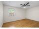 Bright bedroom with wood floors, neutral walls, and a ceiling fan at 4340 Hadaway Nw Rd, Kennesaw, GA 30152
