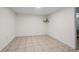 A bright, empty bedroom ready to personalize, featuring neutral walls and tile flooring, awaiting your creative touch at 4340 Hadaway Nw Rd, Kennesaw, GA 30152