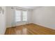 Empty bedroom with wood floors and large windows at 4340 Hadaway Nw Rd, Kennesaw, GA 30152
