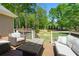 Inviting deck space featuring a fire table and comfortable seating with a backyard view at 4340 Hadaway Nw Rd, Kennesaw, GA 30152