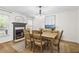 Traditional dining room featuring a fireplace, chandelier and a view to the backyard at 4340 Hadaway Nw Rd, Kennesaw, GA 30152