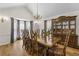 Formal dining room featuring a large wood table, china cabinet and bay window at 4340 Hadaway Nw Rd, Kennesaw, GA 30152