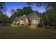 Beautiful home exterior showcasing manicured lawn, garden, and tasteful outdoor lighting at 4340 Hadaway Nw Rd, Kennesaw, GA 30152