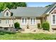 Charming home featuring manicured landscaping, a stone walkway, and a lovely fountain at 4340 Hadaway Nw Rd, Kennesaw, GA 30152