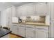 A closer view of the kitchen, highlighting granite countertops and white cabinets at 4340 Hadaway Nw Rd, Kennesaw, GA 30152