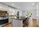 Kitchen with white cabinets, black countertop island and stainless steel oven at 4340 Hadaway Nw Rd, Kennesaw, GA 30152