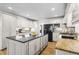 Bright, well-appointed kitchen featuring an island, modern appliances, and white cabinets at 4340 Hadaway Nw Rd, Kennesaw, GA 30152