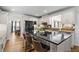 Modern kitchen featuring an island with seating, stainless steel appliances, and granite countertops at 4340 Hadaway Nw Rd, Kennesaw, GA 30152